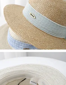 Detail view of woven straw texture with blue ribbon and elegant pearl embellishments