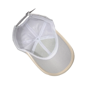 Detail view of the six-panel reinforced interior stitching and adjustable strap of a baseball cap