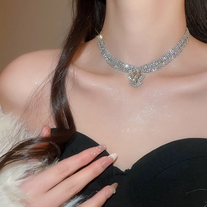 Close-up of sparkling water-drop crystal choker necklace with silver-plated rhinestones