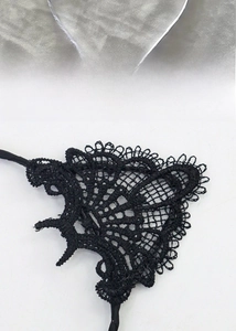 Close-up of black lace cat ears headband with realistic red bloodstain details
