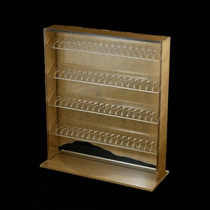 Macro view of clear acrylic jewelry stand showing protective film and multi-tier design