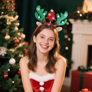 Close-up of sequined reindeer antlers and Christmas tree headband on a model