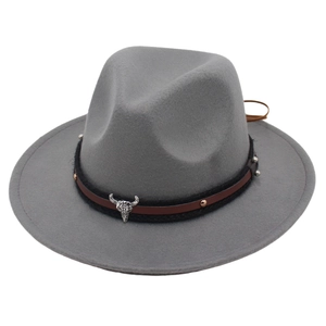 Detail of grey felt fedora featuring western bull skull ornament and metal studs