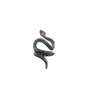 Punk snake shaped open ring in black metal finish with a pear cut red gemstone