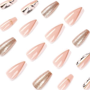 French tip press-on nails with marble patterns and rose gold glitter coffin shapes