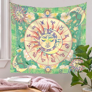 Detail of bohemian sun and moon tapestry featuring zodiac signs and floral patterns