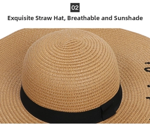 Detail of hand-woven straw sun hat with black ribbon and fine embroidery texture