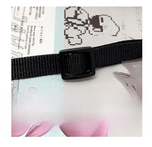 Detail of black nylon shoulder strap with adjustable plastic buckle for plush bags