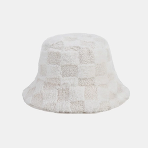 Close-up of cream white checkered plush bucket hat showing fuzzy faux fur texture details
