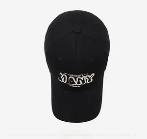 Overhead view of black cotton baseball cap with MANY CAPABILITY charm letter embroidery