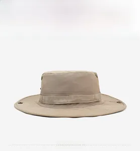 Detail of khaki fishing hat showing side metal snap buttons and breathable vents