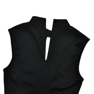 Close-up of black sleeveless dress back with hollow-out detail and hidden zipper