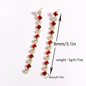 Long crystal drop earrings featuring red and clear zircon stones in a gold setting