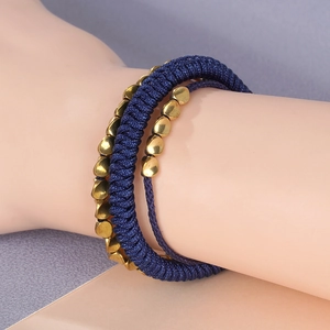 Handmade navy blue braided multi-layer wrap bracelet with irregular golden metal beads