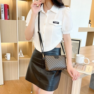 Fashionable crossbody bag with geometric brown prints and elegant black flap for women