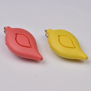 Leaf-shaped personal safety alarm in pink and yellow with metal keychains and side speaker