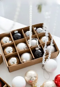 Macro detail of assorted 6cm Christmas glass balls in a vintage kraft box packaging