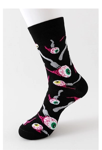 Detail of black cotton socks with colorful cartoon eye prints shown on a leg mold