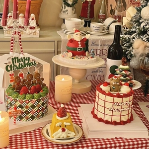 Festive Christmas cake set featuring burgundy bows and Merry Christmas gold stamped toppers