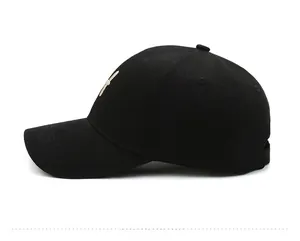 Side view of black cotton twill baseball cap showing curved brim and embroidered logo