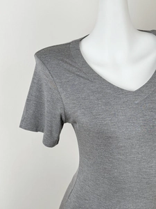 Detail shot of the V-neckline and knit texture on this slim fit grey short sleeve T-shirt