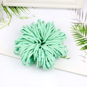 Macro shot of mint green high-elasticity hair ties with square plastic buckles