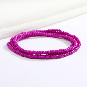 Detail of double-layered purple glass seed beads jewelry for beach bikini outfits