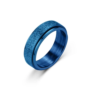 Detail of blue spinner ring showing sandblasted outer surface and brushed metal interior
