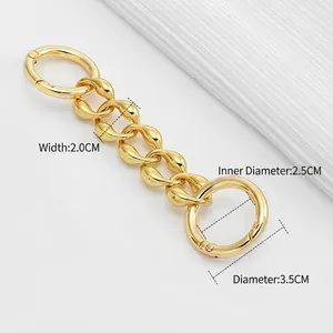 Polished gold metal chain strap extension for crossbody bags with circular spring buckles
