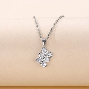 Minimalist silver titanium necklace with double row zircon bar pendant on beige background