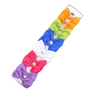 Close-up of 6-piece colorful ribbed grosgrain ribbon bow hair clips on a display card