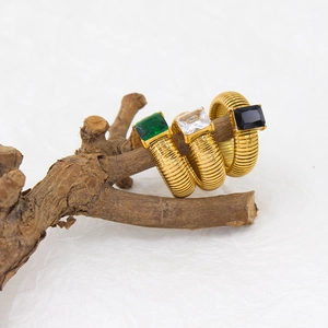 French vintage gold rings set with striped texture and emerald zircon on a natural branch