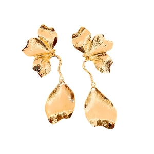 Gold metal flower earrings with textured petals and minimalist aesthetic design