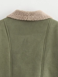 Detailed close-up of olive green suede jacket with textured faux shearling collar