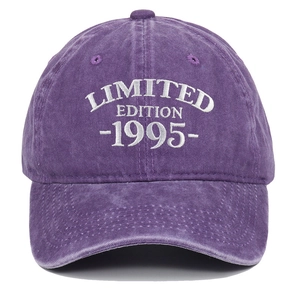 Detailed close-up of white Limited Edition 1995 embroidery on a purple washed cotton cap
