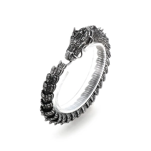 Punk style stainless steel dragon bracelet with green eyes and detailed silver scales