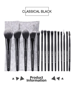 Detail of 15pcs professional black makeup brushes with a grey felt storage pouch