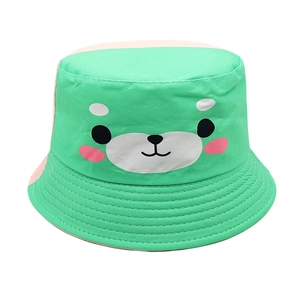 Detail of green kids bucket hat featuring cartoon bear face and reinforced brim stitching