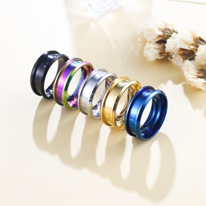Macro shot of 8mm double-grooved stainless steel ear tunnels in five vibrant finishes