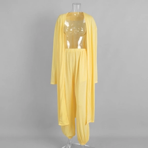Detail of light yellow long cardigan and cuffed trousers set in thin knit fabric