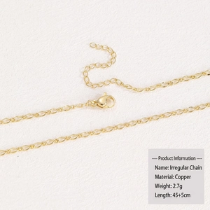 Macro detail of 18k gold plated copper irregular O-shape chain with lobster clasp