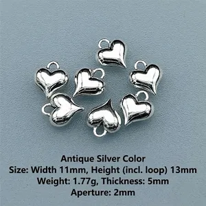 Detail of 11x13mm vintage silver heart charms with precise dimensions and weight for DIY