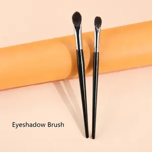 Detail of eyeshadow brush set with black lacquer handles and soft synthetic bristles