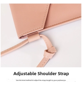 Close-up of pink PU leather phone bag showing adjustable knotted shoulder strap details