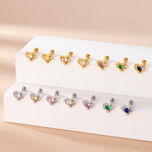 Colorful zircon heart stud earrings in gold and silver finish on display stand