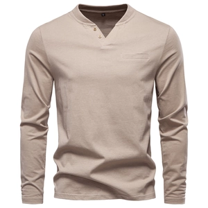 Detail view of khaki long sleeve Henley shirt with V-neck button and cotton texture