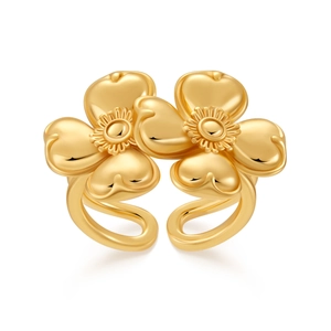 Detailed close-up of 18K gold plated ring featuring dual floral design and intricate texture