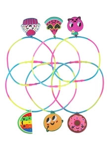 Detail of colorful children fruit party rings with watermelon and strawberry charms