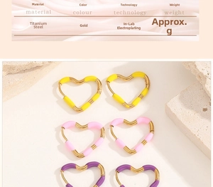 Detail of heart hoop earrings in pink and purple resin on gold-plated titanium steel