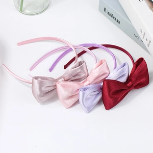 Set of four elegant satin bow headbands in burgundy, purple, and pastel pink shades